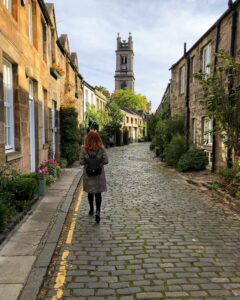 Woman Walking Down Street